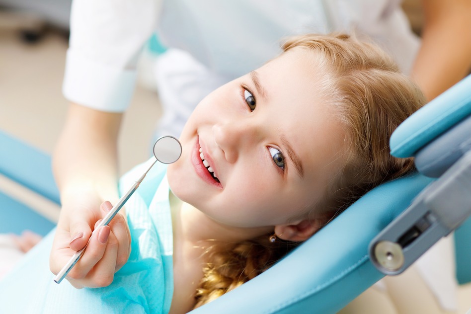 Little girl visiting dentist